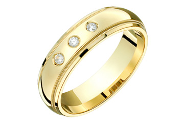 9/100 Carat Yellow Gold Wedding Band With Three Diamonds